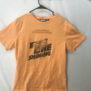 Peach colored shirt with The Shining graphic